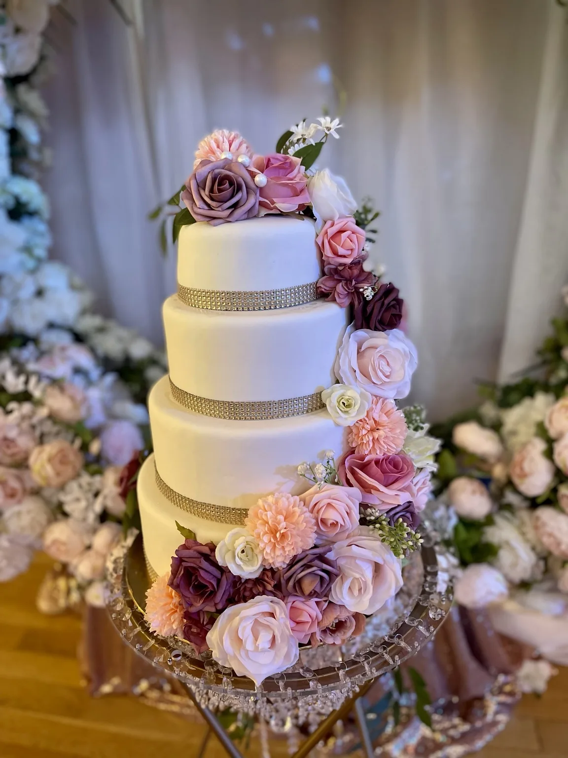Elegant four-tier floral wedding cake by Blue Skye Cakes